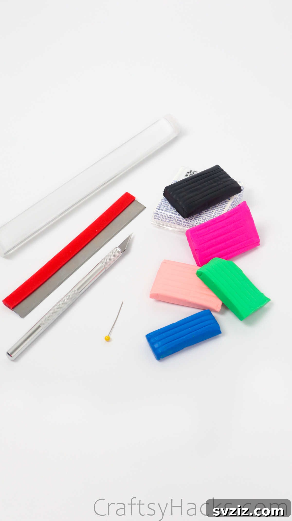 Crafting Your Own Clay Rings Effortlessly 5 Arrangement of polymer clay, rolling pin, cutting tools, and a sewing pin – all the craft supplies needed for making clay rings