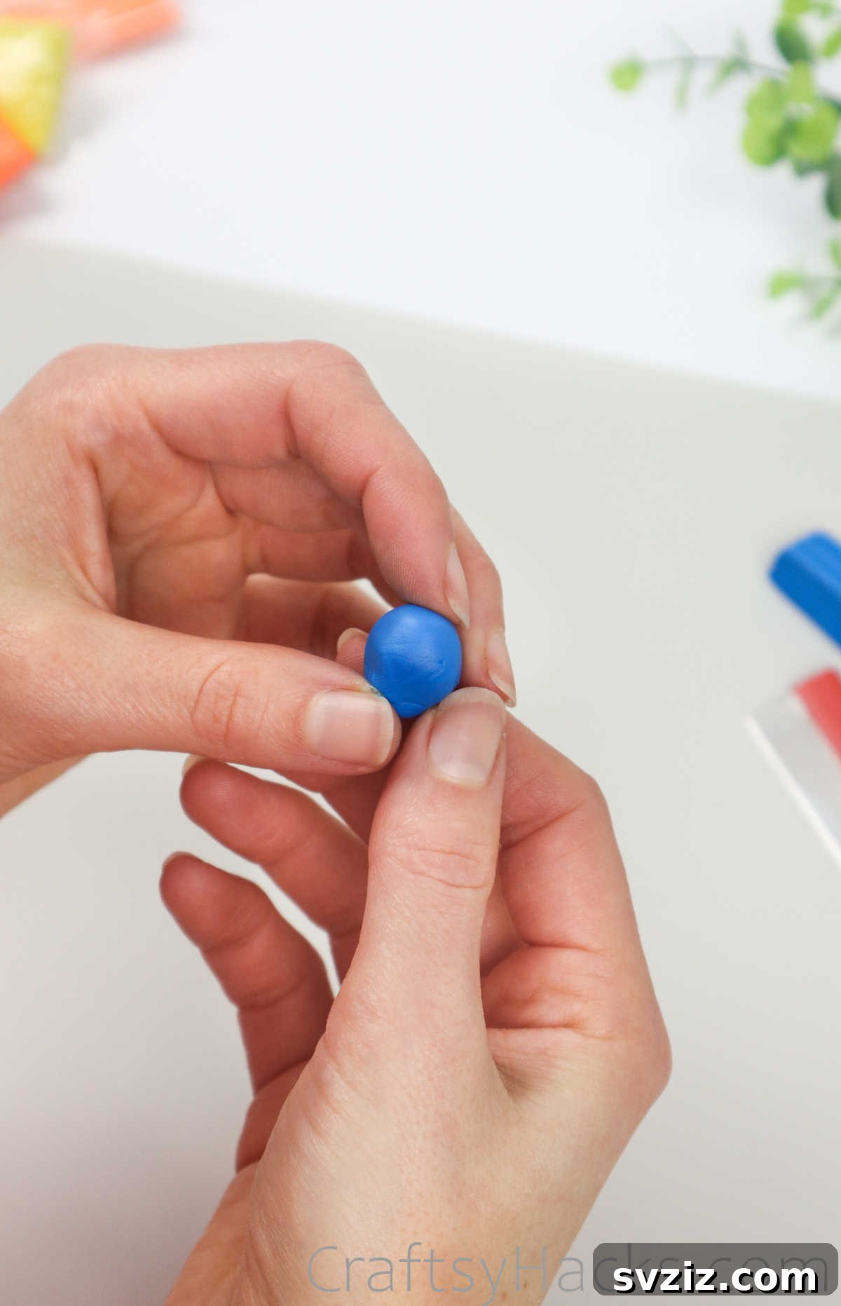 Crafting Your Own Clay Rings Effortlessly 6 A smooth, round ball of blue polymer clay, ready for shaping