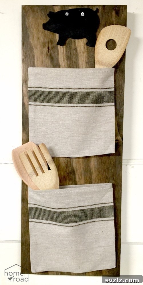 20 Game-Changing IKEA Kitchen Hacks 15 DIY grain sack wall organizer made from a wooden plank and IKEA cloth napkins