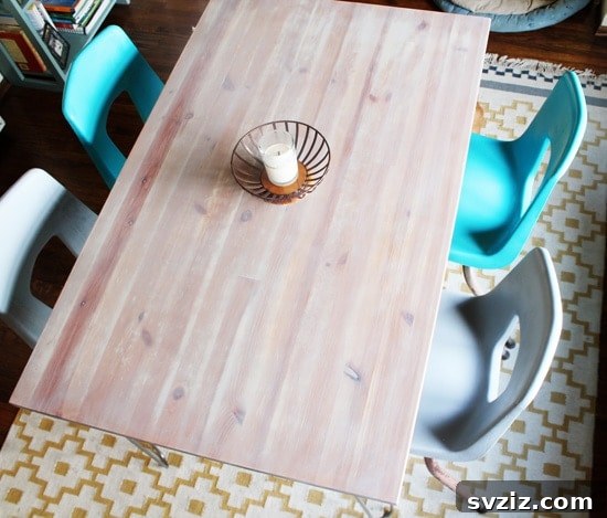 20 Game-Changing IKEA Kitchen Hacks 4 Minimalistic dining table created from an IKEA JOKKMOKK table with hairpin legs