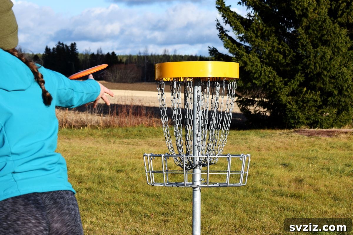 A child throwing a frisbee towards a target for Frisbee Golf