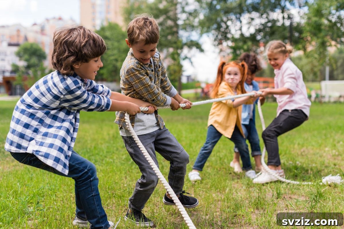 Two teams of children competing in a Tug of War game