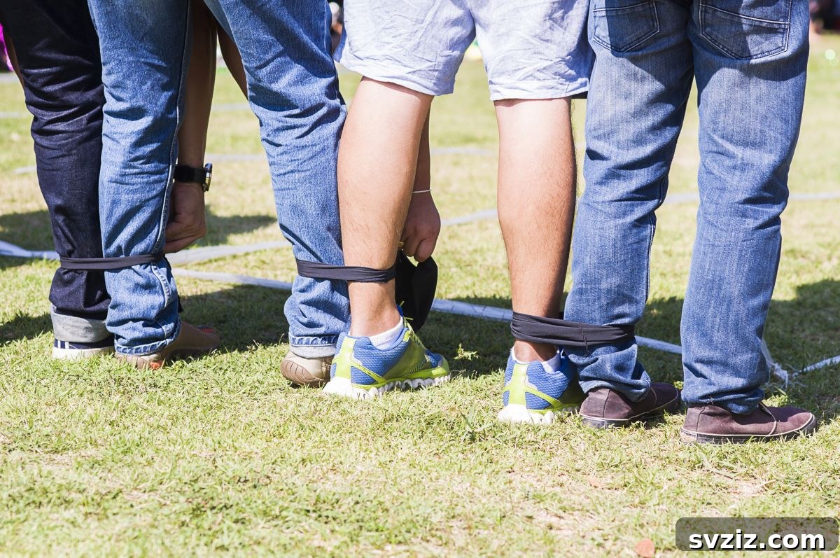Kids playing a 3-Legged Race at an outdoor party