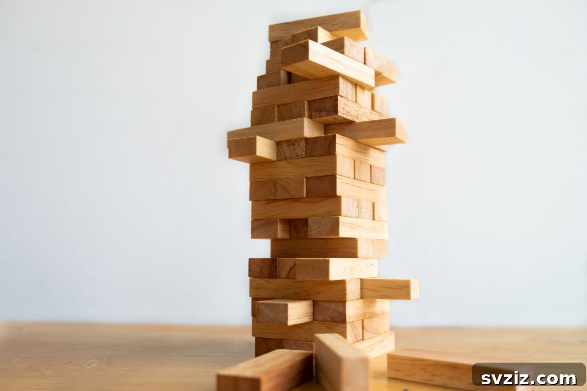Children carefully removing blocks from an Oversized Jenga tower