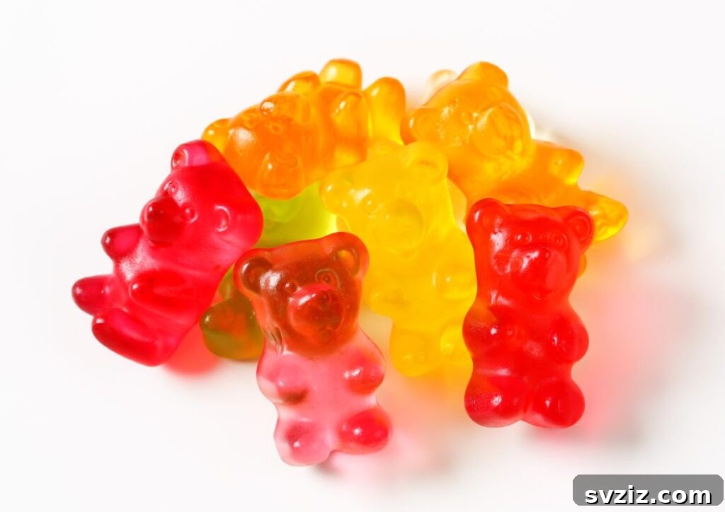 Child's face covered in whipped cream while searching for gummy bears