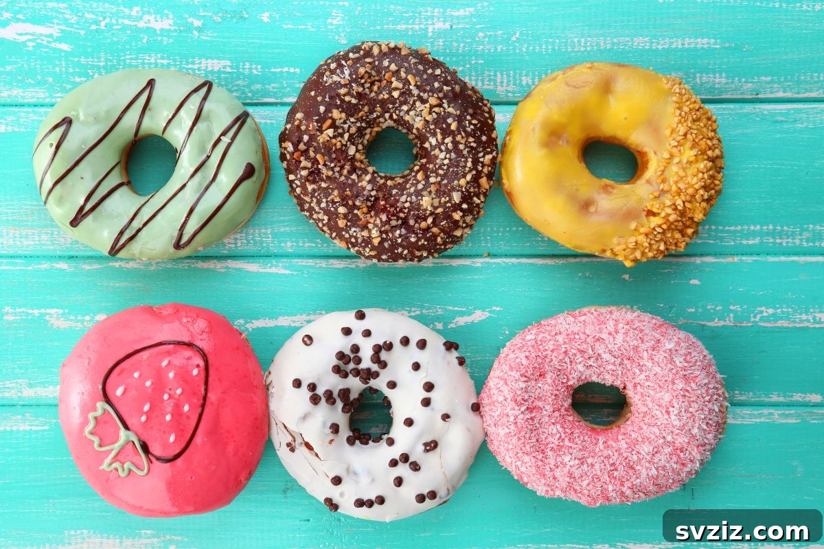 Kids attempting to eat donuts hanging from a string without hands