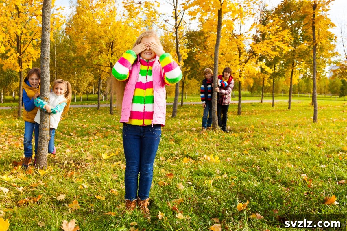 Children playing hide and seek behind a large tree