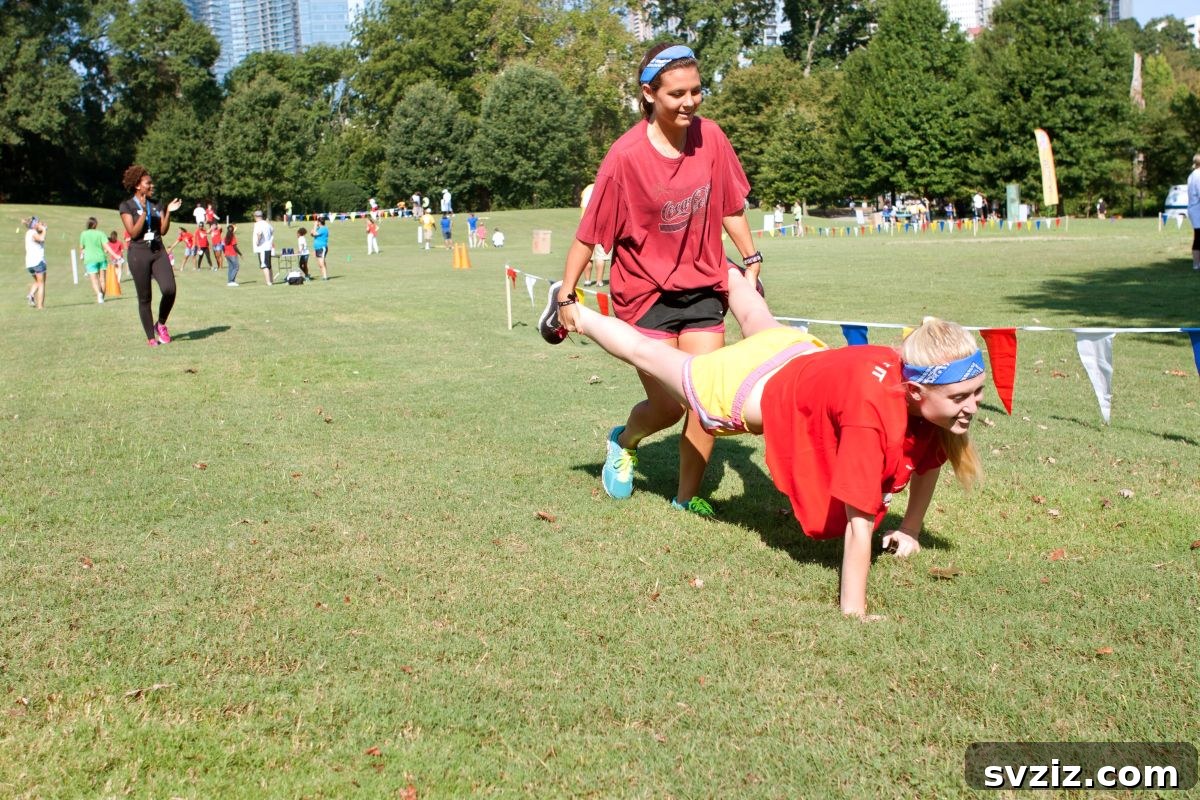 Two children participating in a Wheelbarrow Race outdoors