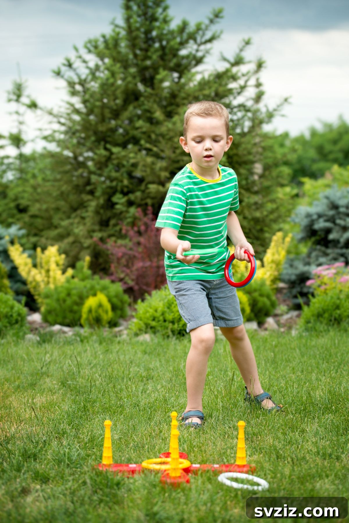 Kids playing a Ring Toss game at an outdoor carnival party