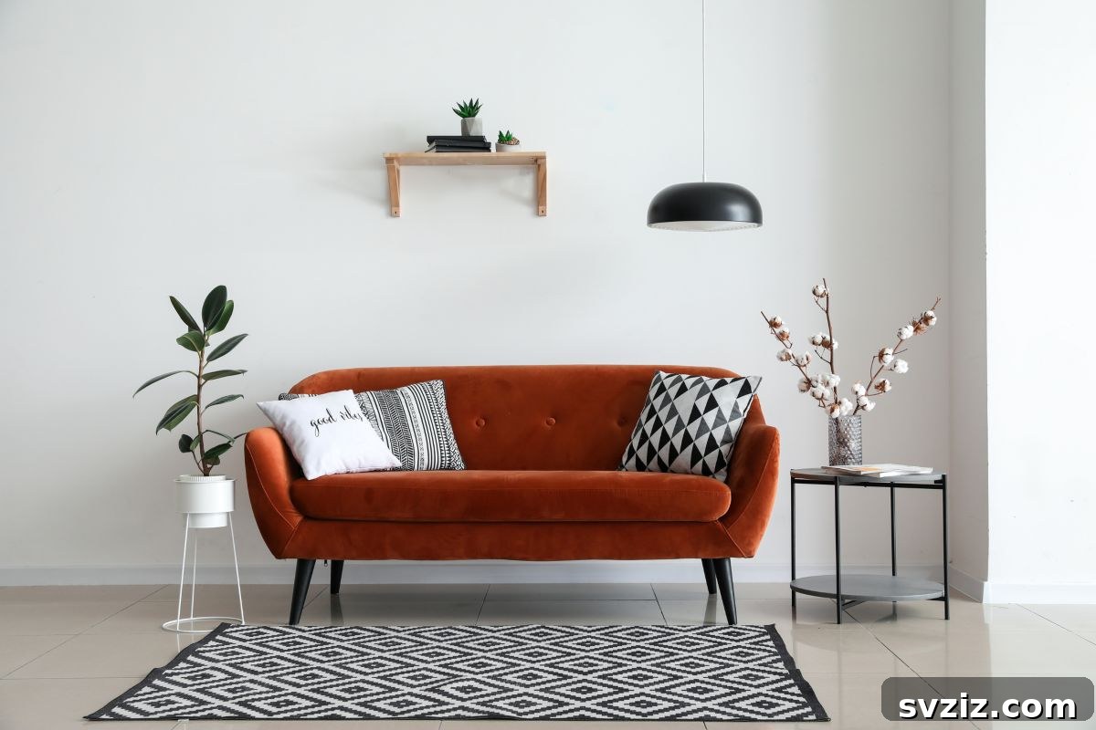 Elegant light fixture hanging from the ceiling above a sofa, setting the room's tone