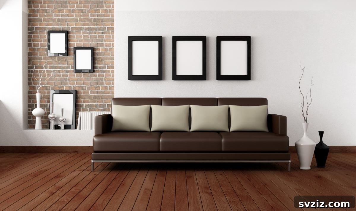 Three elegant photo frames above a sofa, showcasing classic wall decor