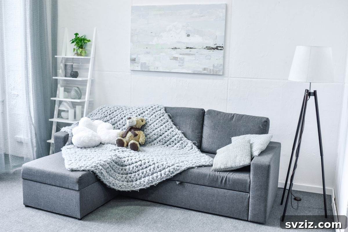 Large monochrome abstract painting above a modern sofa, creating an urban chic vibe