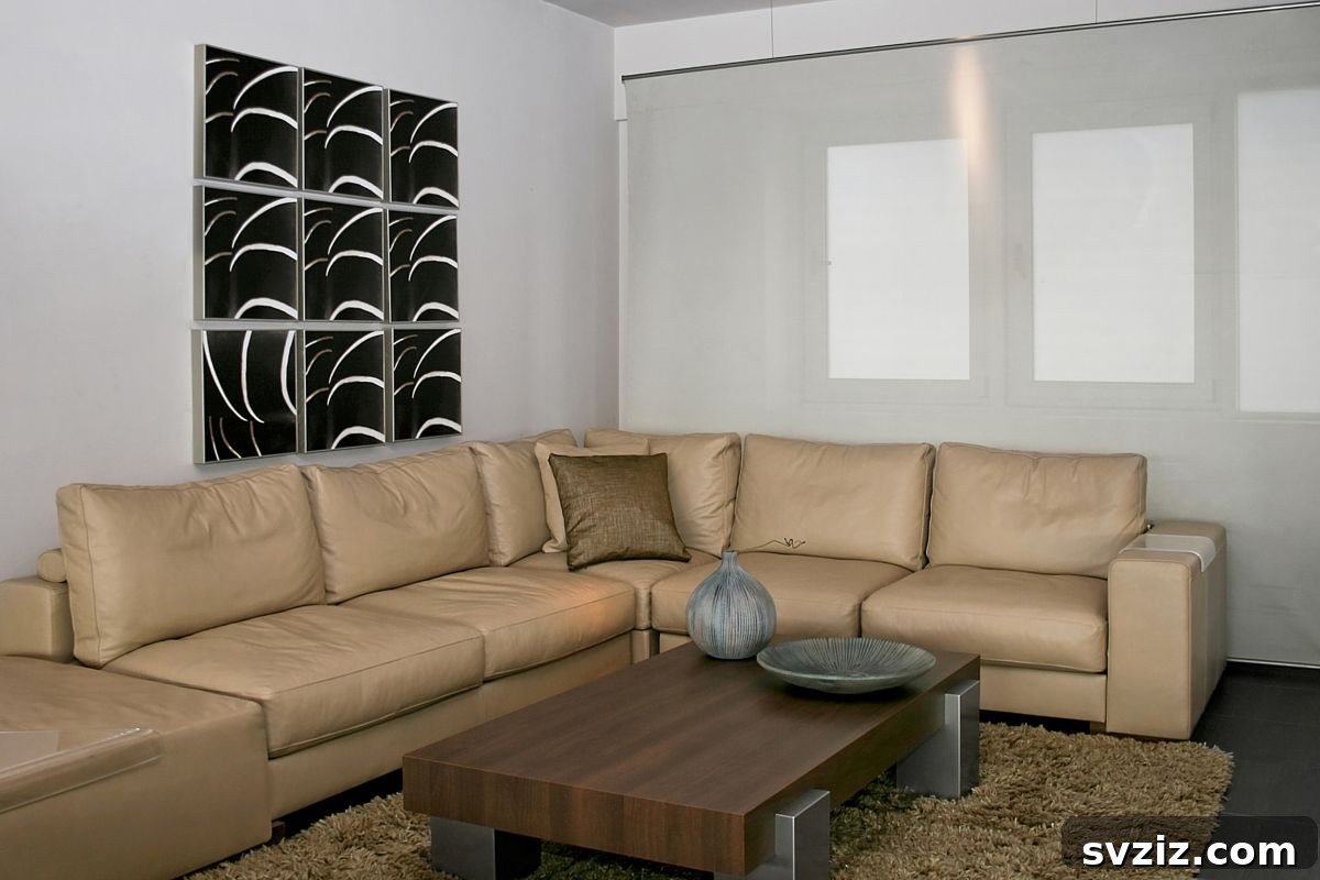 Modern grid-shaped gallery wall above a sofa, displaying abstract art or split photos