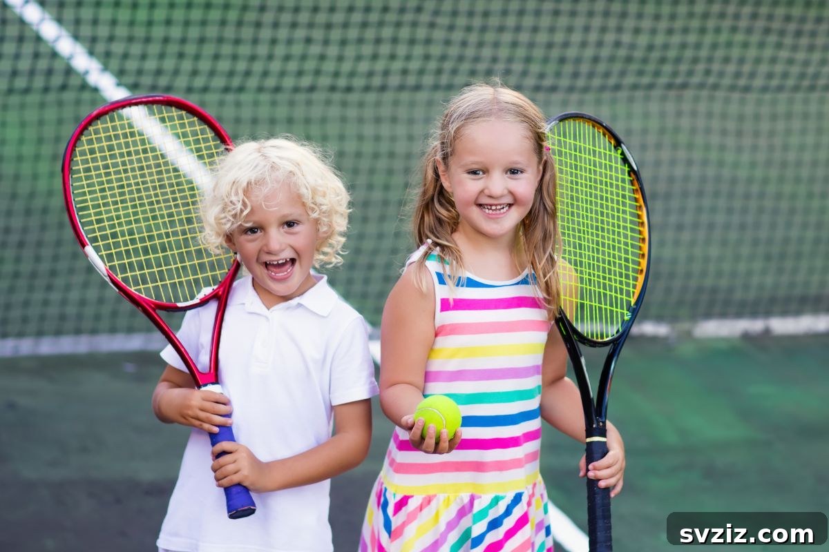 Children Learning to Play Tennis Outdoors