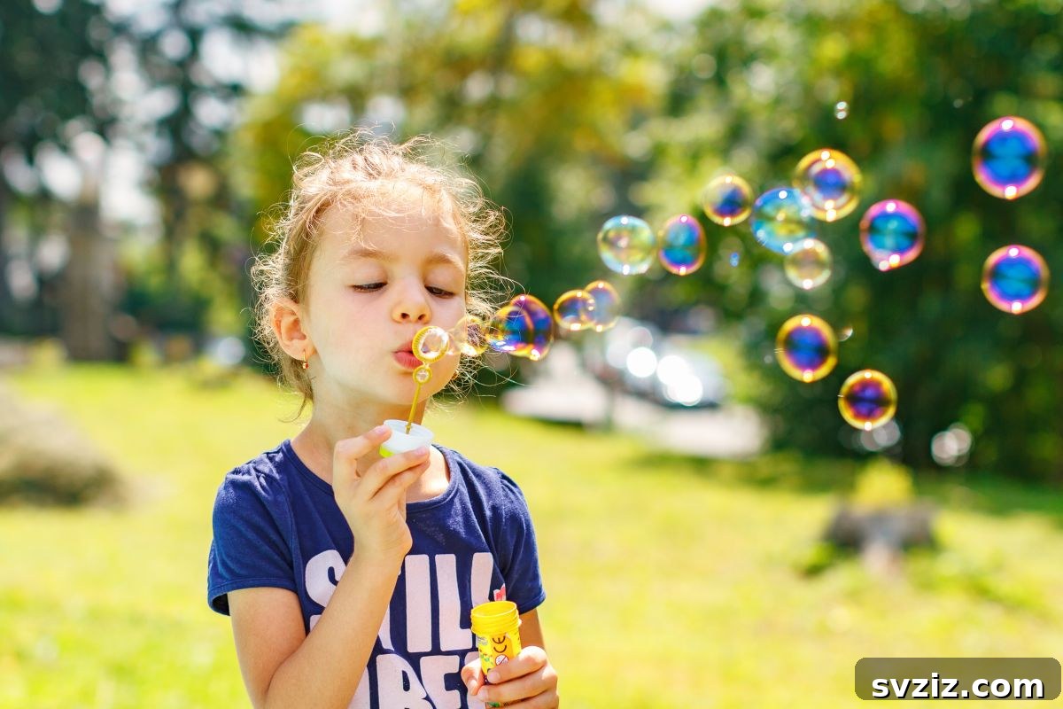 Child Happily Blowing Bubbles Outdoors