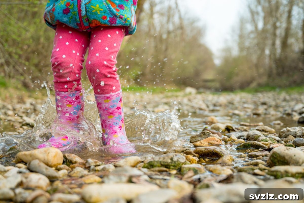 Child Joyfully Splashing in a Puddle After Rain