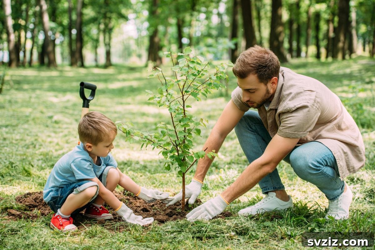 Child and Adult Planting a Tree in a Garden