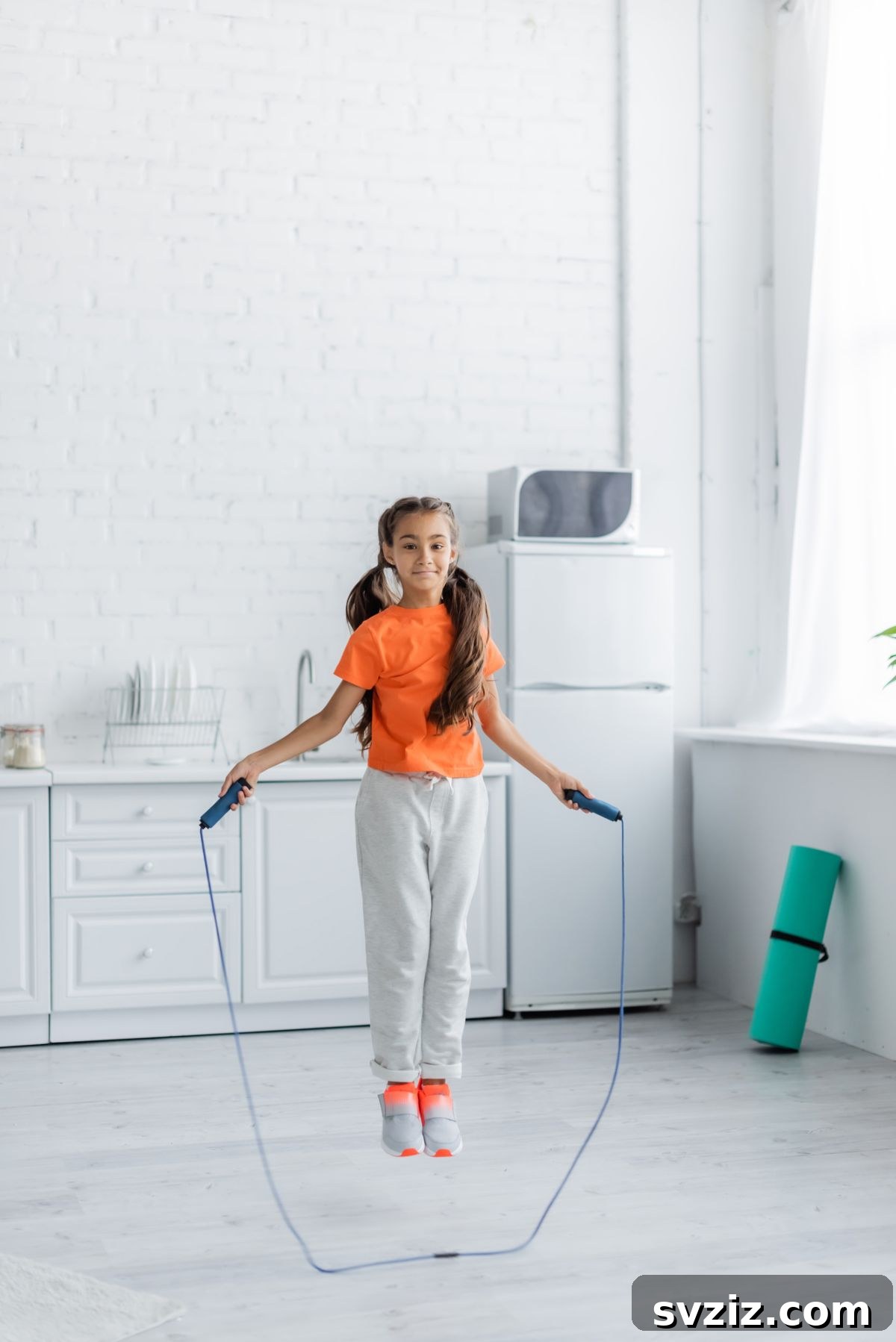 Child Energetically Jumping Rope Outdoors