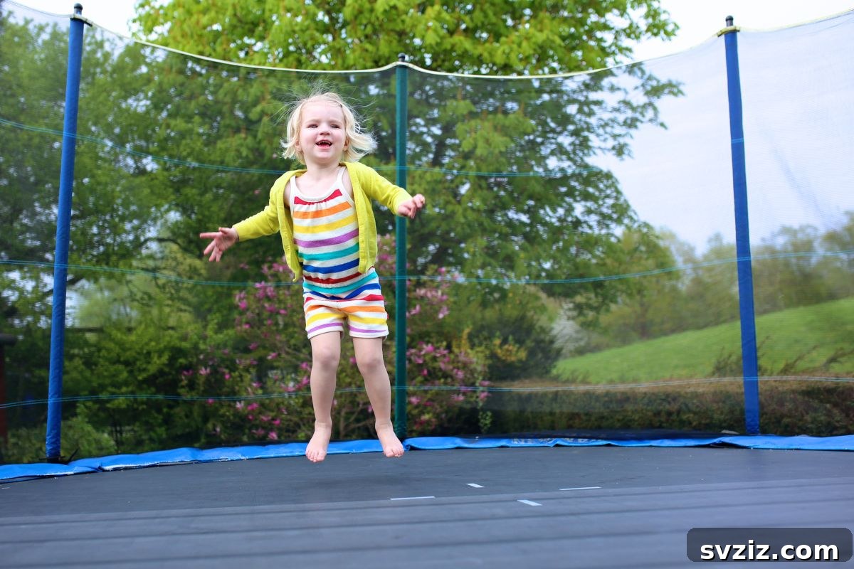 Kids Jumping Joyfully on a Backyard Trampoline