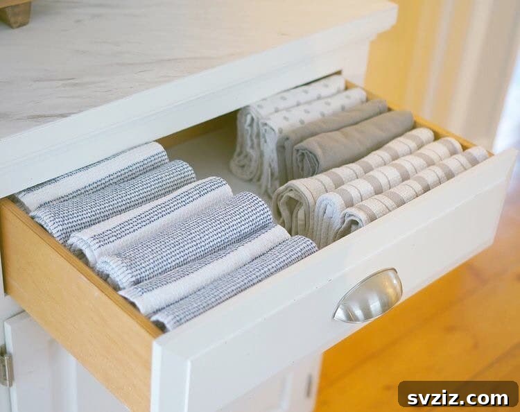 Folded Hand Towels Stored in a Bathroom Drawer