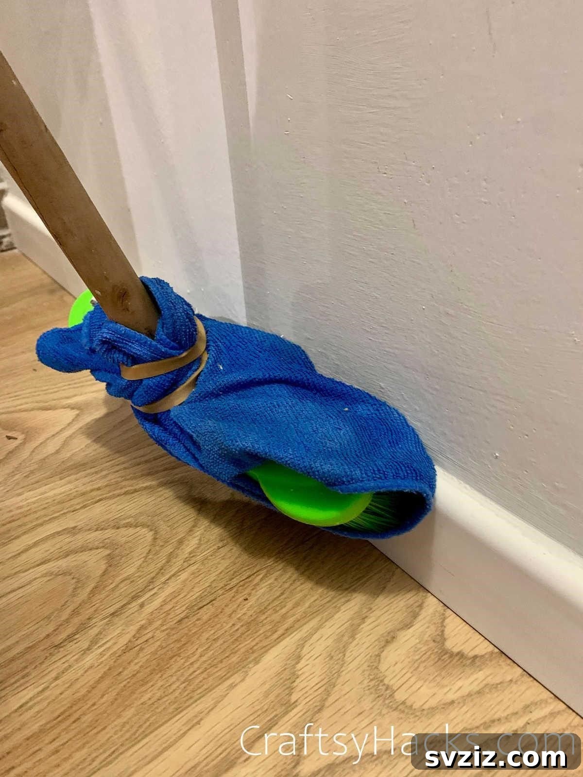 20 Game-Changing Cleaning Hacks to Reclaim Your Time 3 Broom with microfiber cloth to clean baseboards