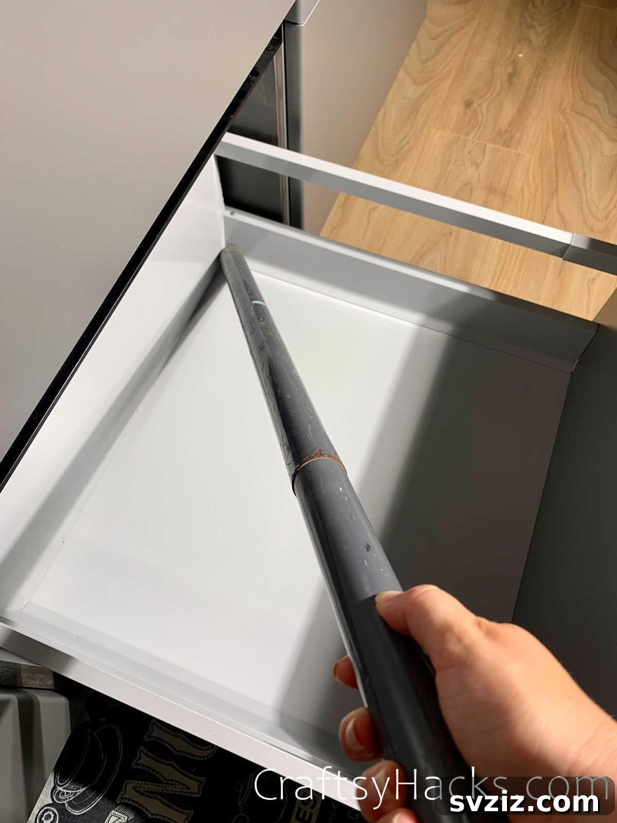 20 Game-Changing Cleaning Hacks to Reclaim Your Time 21 Vacuuming the inside of kitchen cabinets