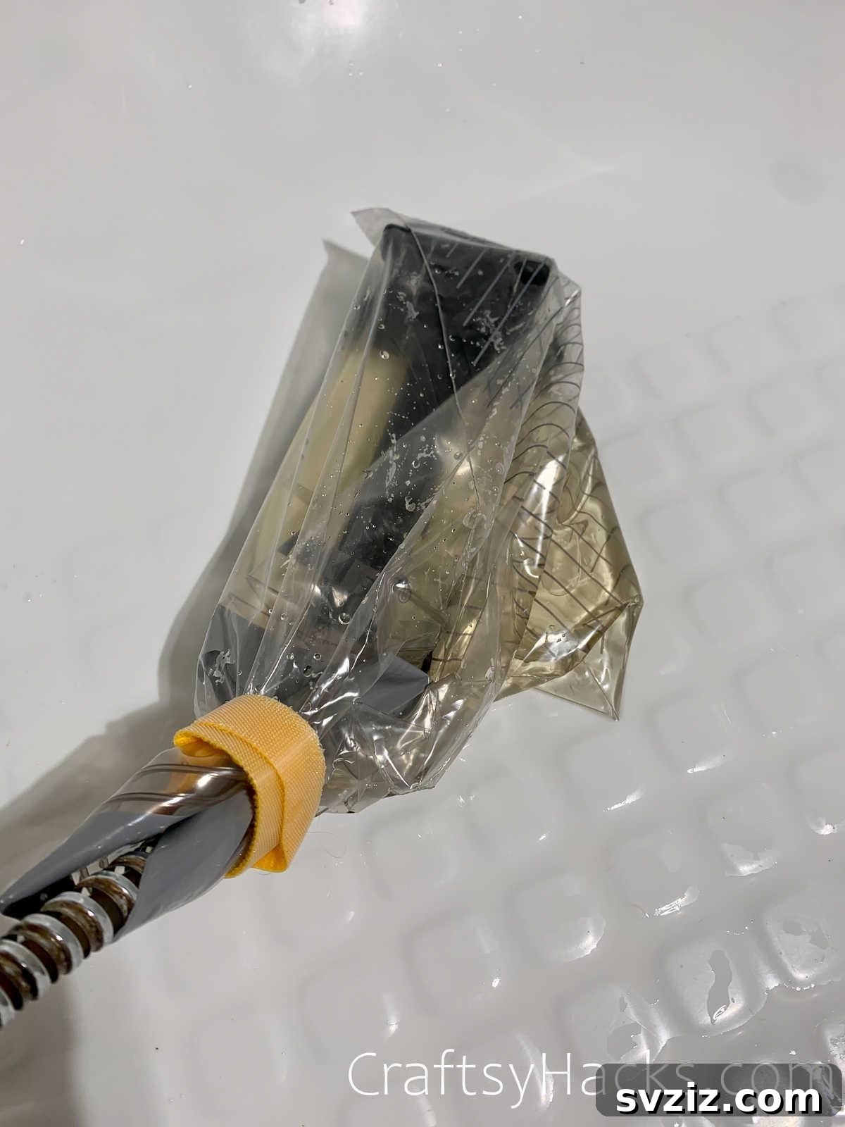 20 Game-Changing Cleaning Hacks to Reclaim Your Time 8 Shower head soaking in a bag of white vinegar overnight