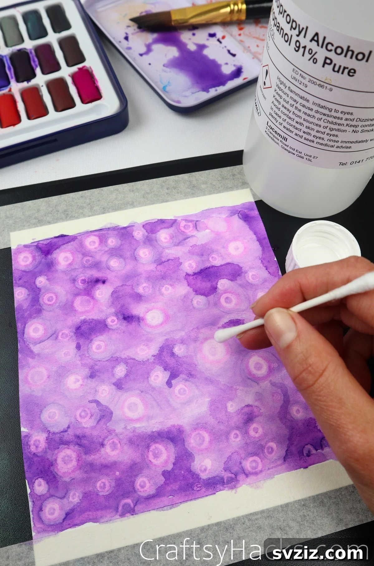 Create unique blooming and cell-like effects in watercolor using drops of isopropyl alcohol.