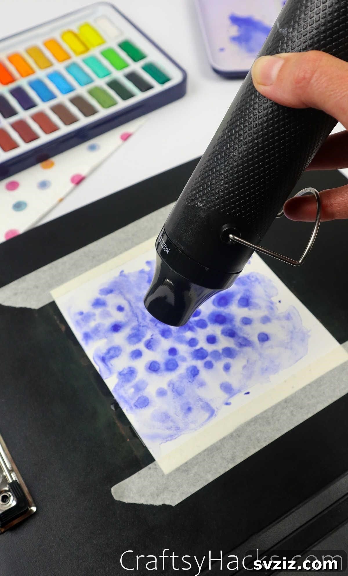 Use a heat gun to quickly dry watercolor layers and prevent colors from mixing unintentionally.
