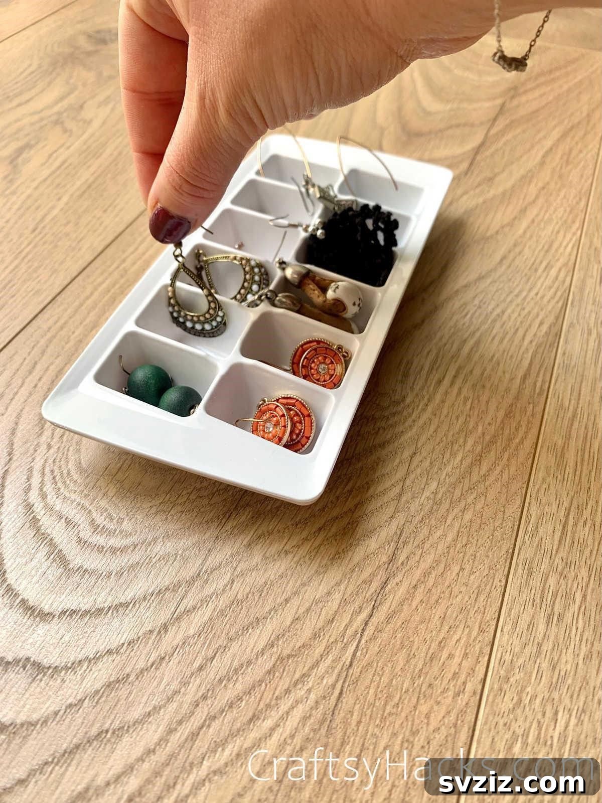 Organize jewellery in ice cube tray for tangle-free storage