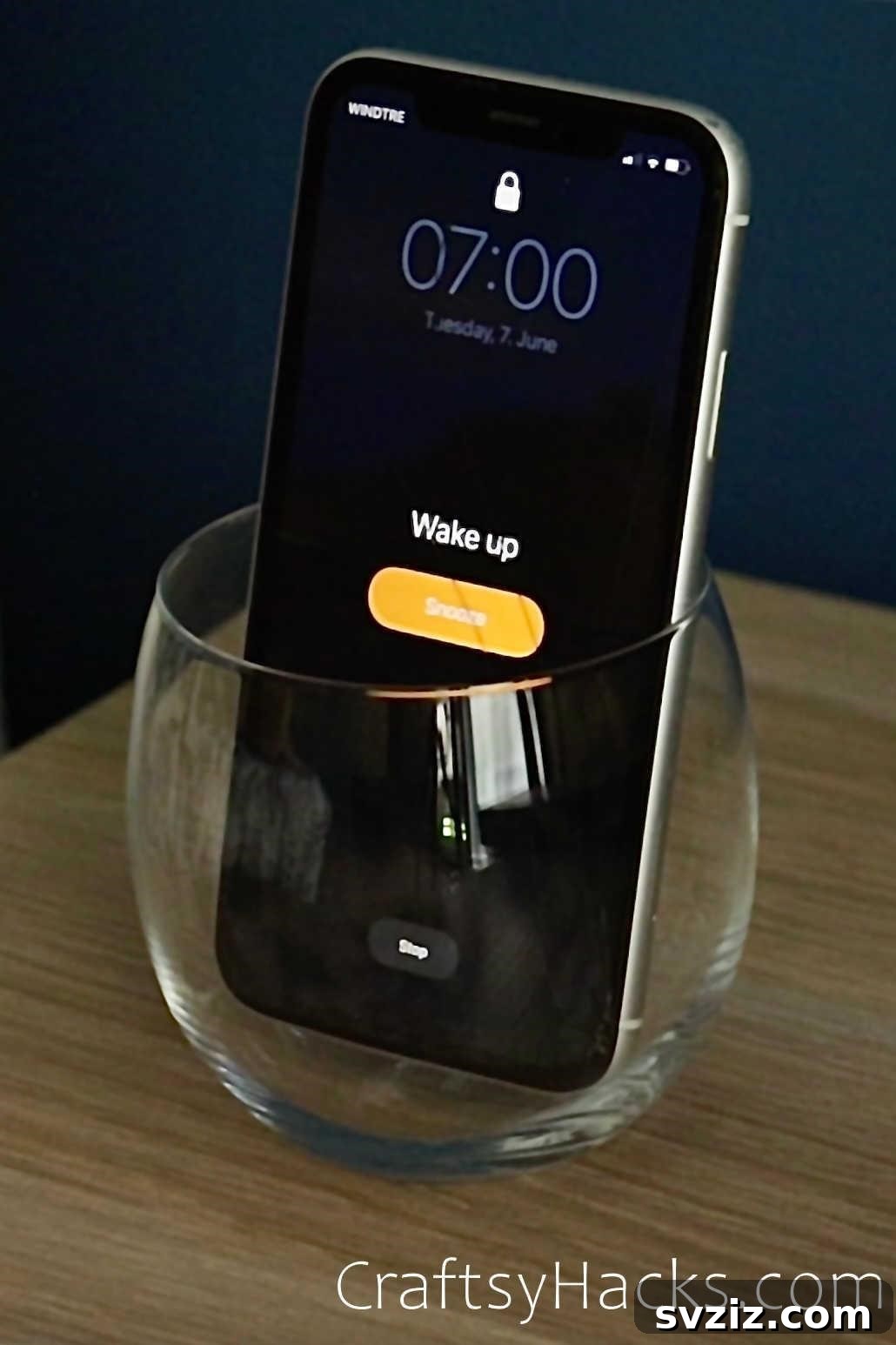Cell phone in glass to increase alarm volume and wake up on time