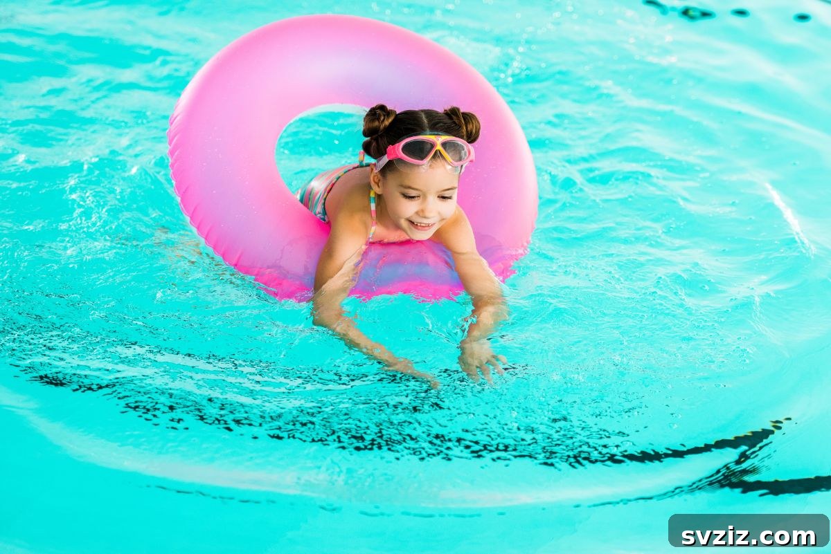 Little Explorers: 41 Outdoor Play Ideas for Preschoolers 12 Child playing with floating toys in a swimming pool, learning about buoyancy