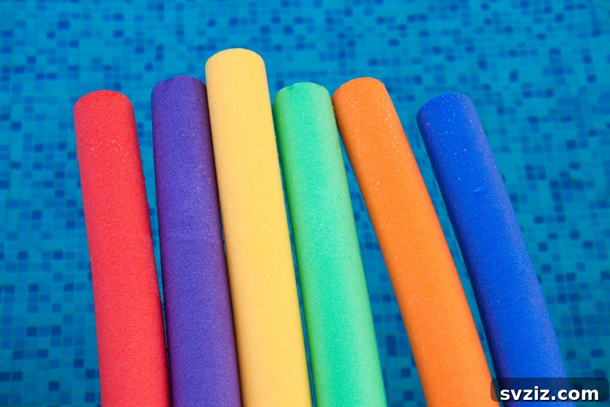 Little Explorers: 41 Outdoor Play Ideas for Preschoolers 14 Kids playing pool noodle ring toss with water balloons on a sunny day