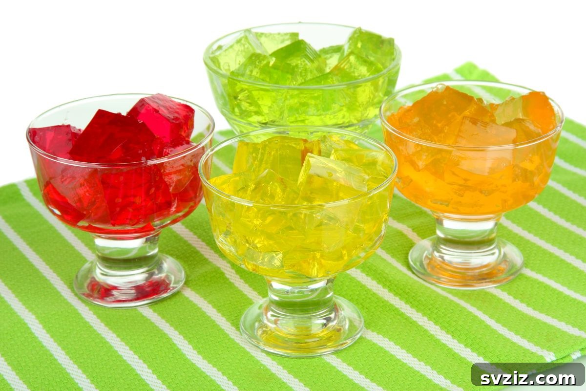 Little Explorers: 41 Outdoor Play Ideas for Preschoolers 21 Child digging into a Jello sensory bin with hidden toys