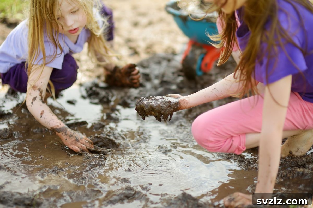 Little Explorers: 41 Outdoor Play Ideas for Preschoolers 27 Child making mud pies in an old tub with dirt and water