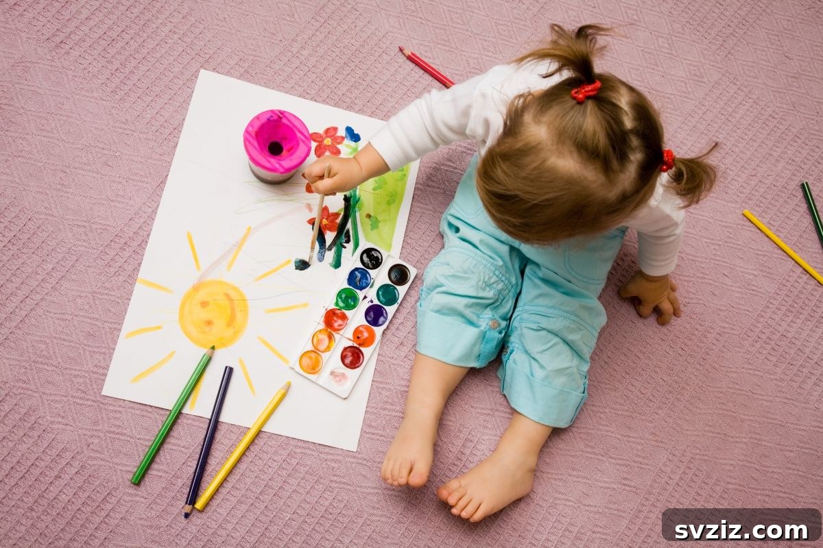 Little Explorers: 41 Outdoor Play Ideas for Preschoolers 37 Child painting with colorful ice cubes on paper outdoors
