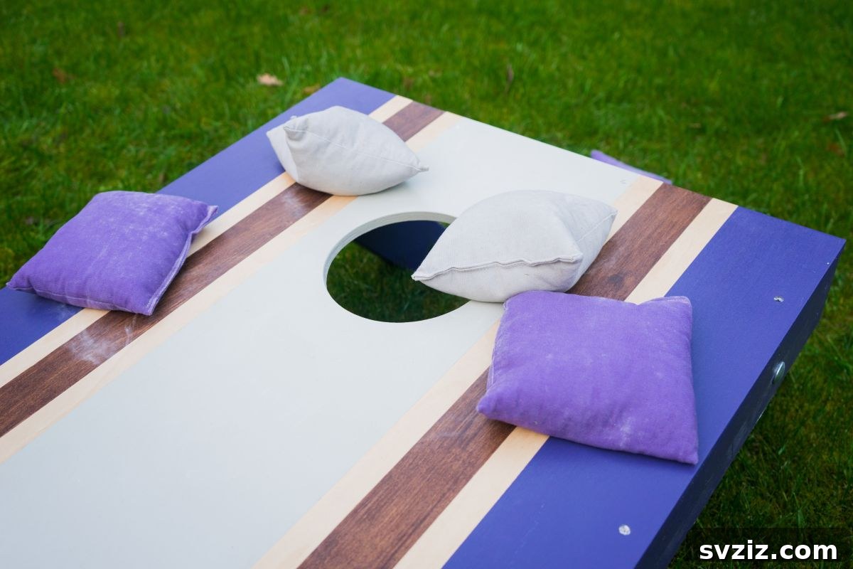 Children playing a bean bag toss game at a party