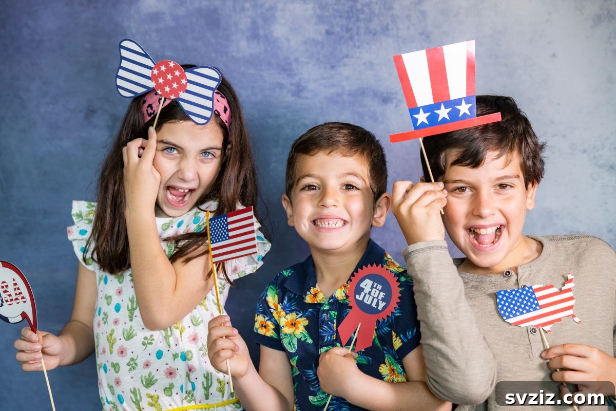 Kids posing with props in an indoor photo booth