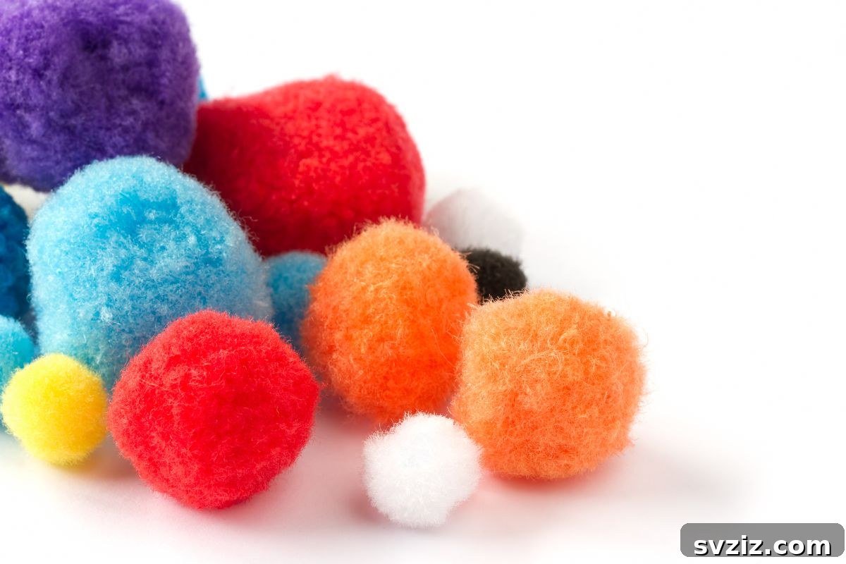 Spark Their Curiosity: 41 Engaging Activities for 3-Year-Olds 3 Pom Pom Water Sensory Bin for toddlers