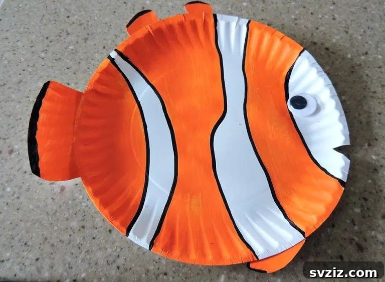 Colorful paper plate fish craft inspired by Nemo