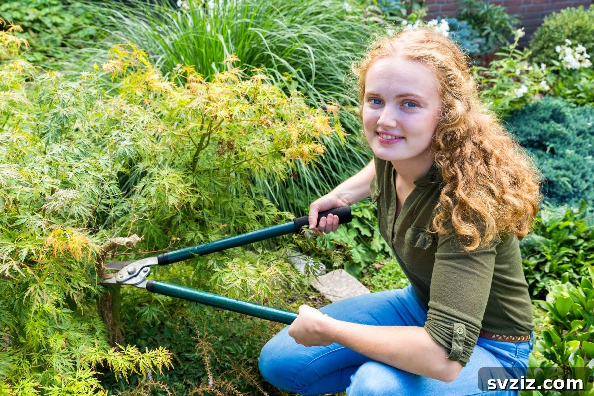 Teenager doing yard work to maintain outdoor space