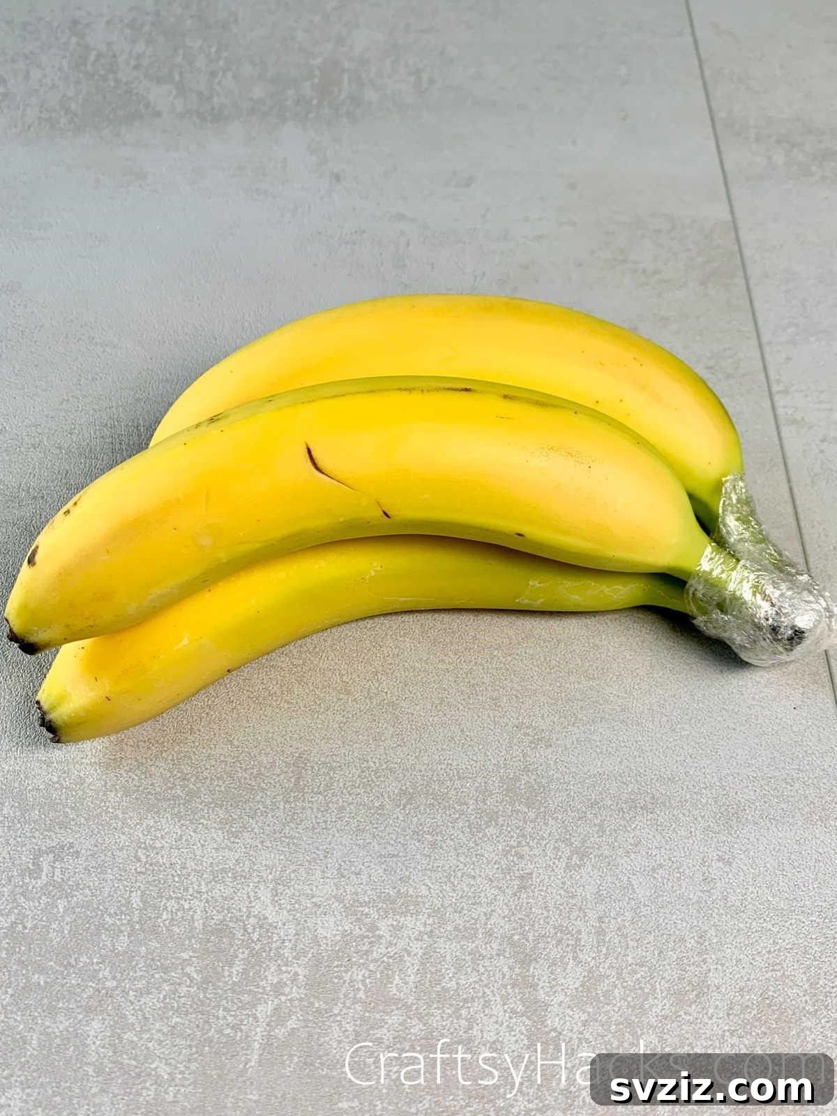 20 Smart Ways to Maximize Food Freshness 3 prevent bananas from ripening with saran wrap