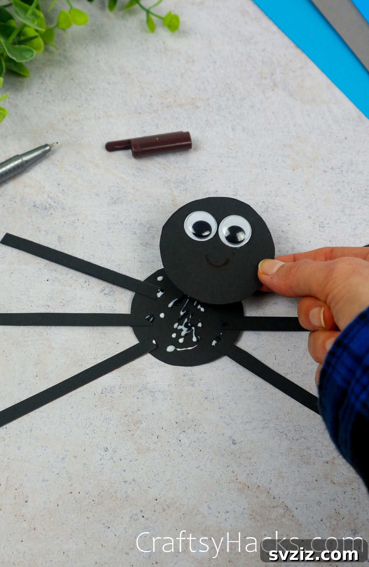 Spin a Web of Fun: Easy Paper Spider Craft 17 glue head onto body