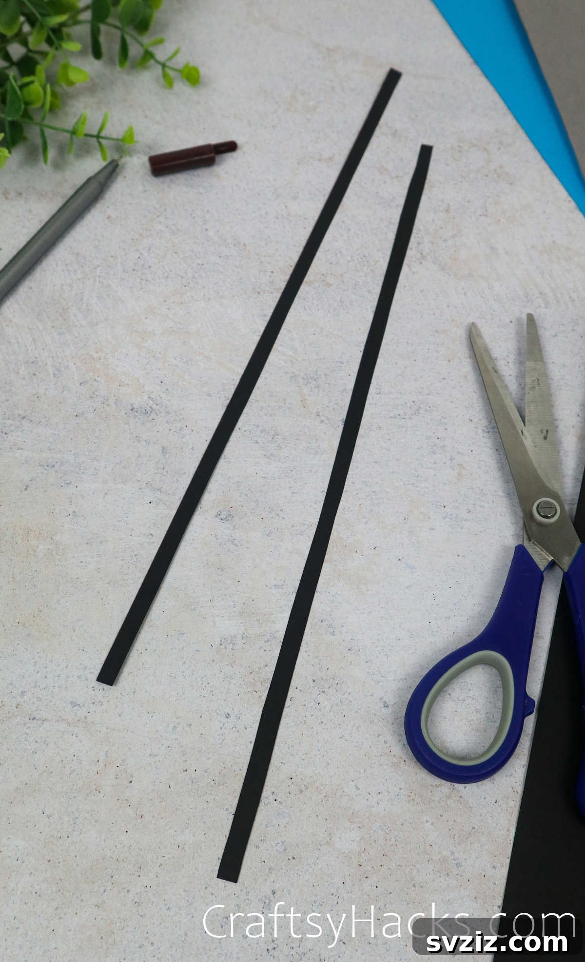Spin a Web of Fun: Easy Paper Spider Craft 7 two long strips of black paper