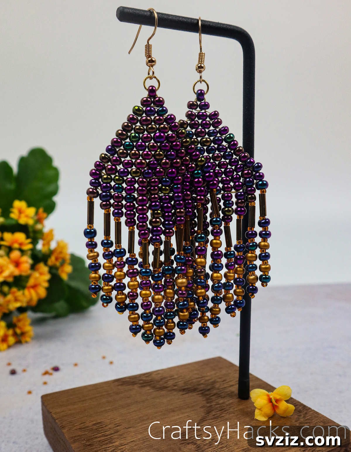 Craft Your Own Beaded Earrings 3 A pair of stylish hanging beaded earrings showing intricate beadwork.
