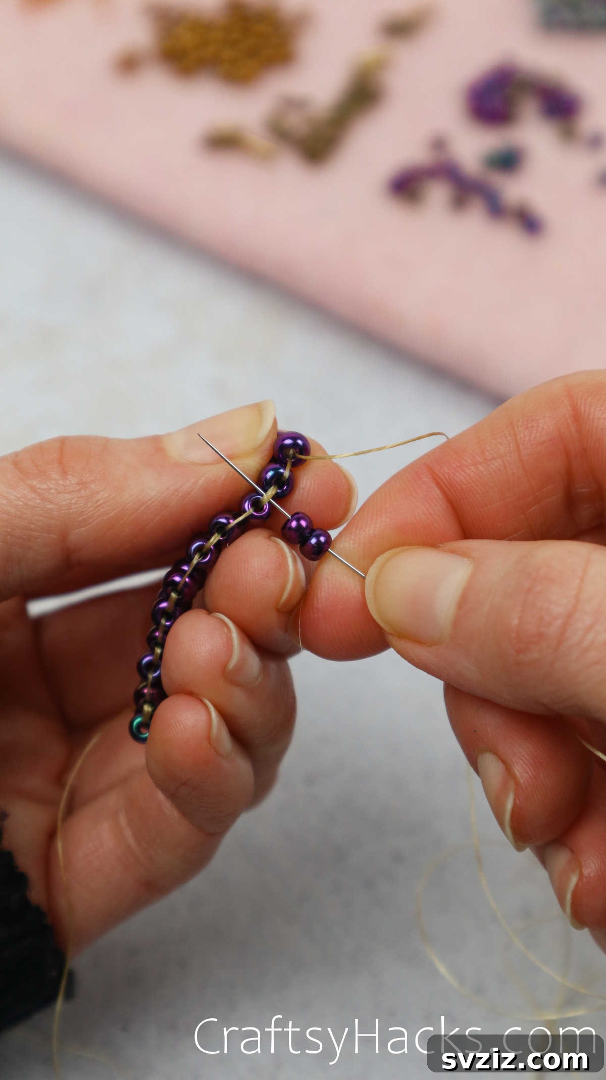 Craft Your Own Beaded Earrings 26 Close-up view of two new beads added, threaded through the second bridge.