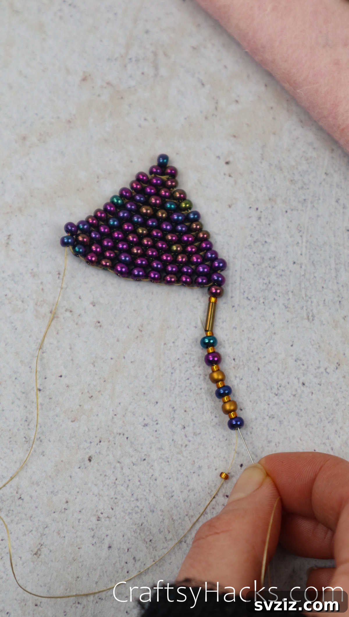 Craft Your Own Beaded Earrings 49 Needle threading beads for the fringe, demonstrating the technique.