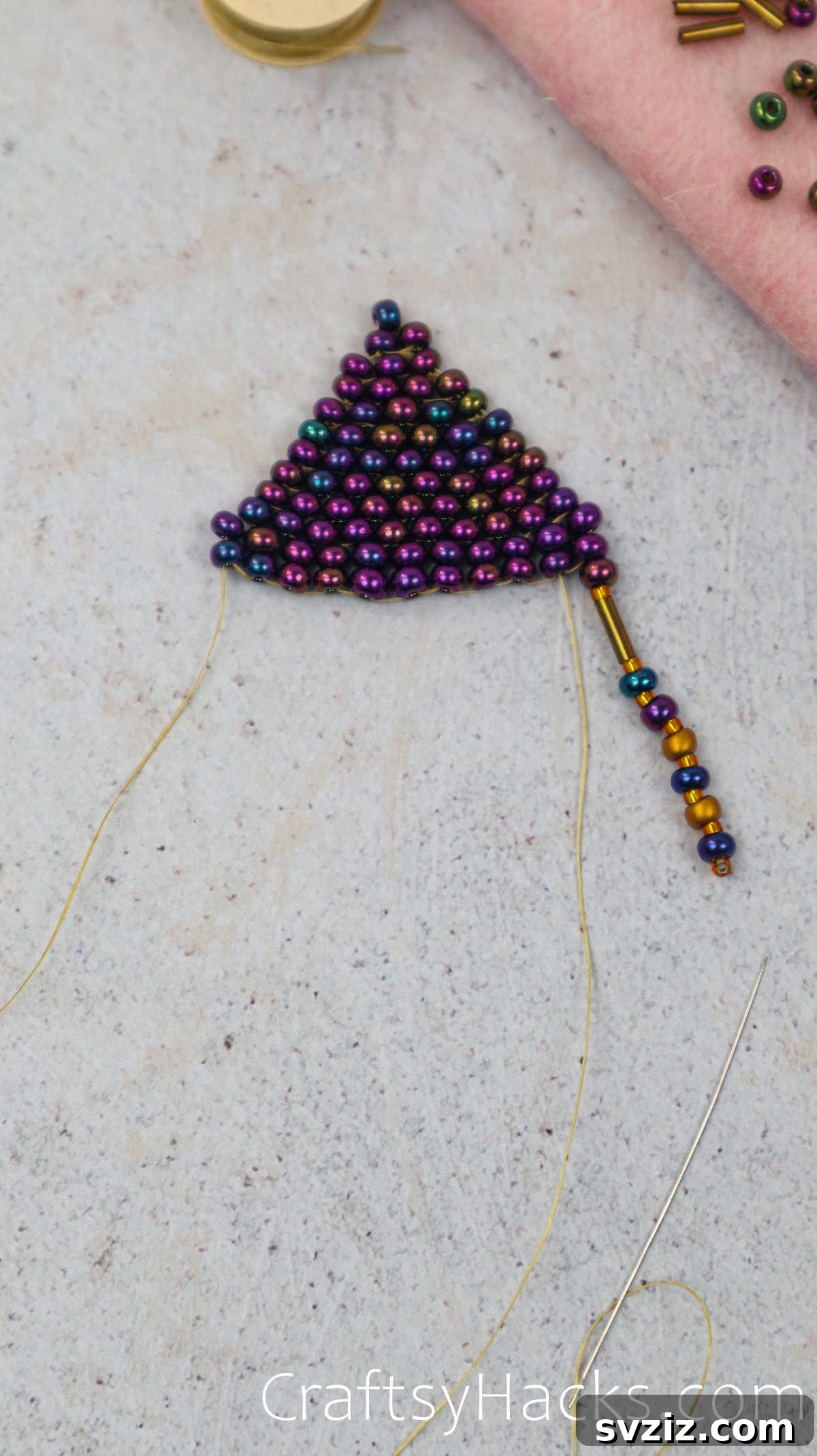 Craft Your Own Beaded Earrings 53 Thread pulled down through a ladder bead to initiate the next fringe line.