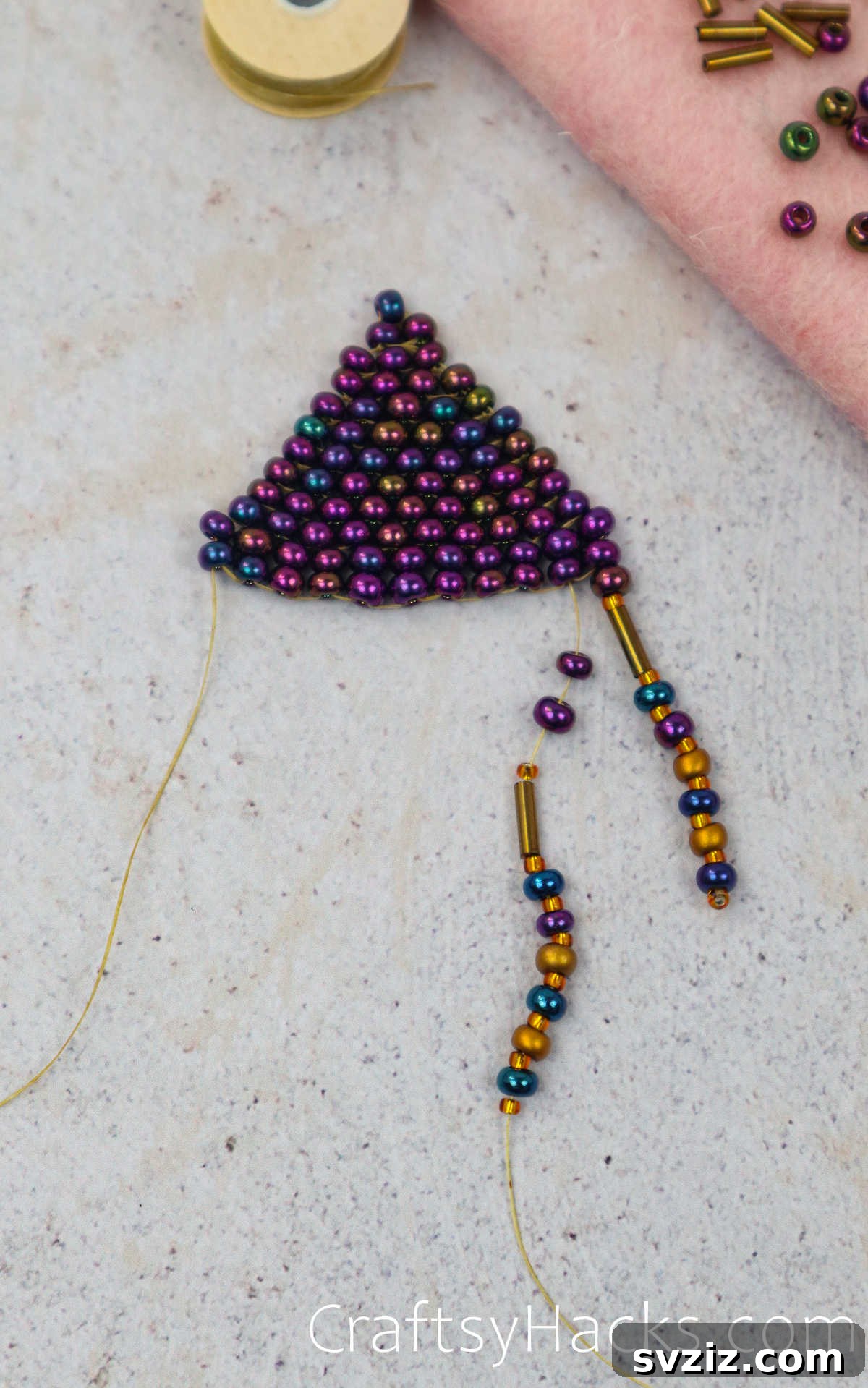 Craft Your Own Beaded Earrings 54 Second string of fringe being added to the beaded earring.