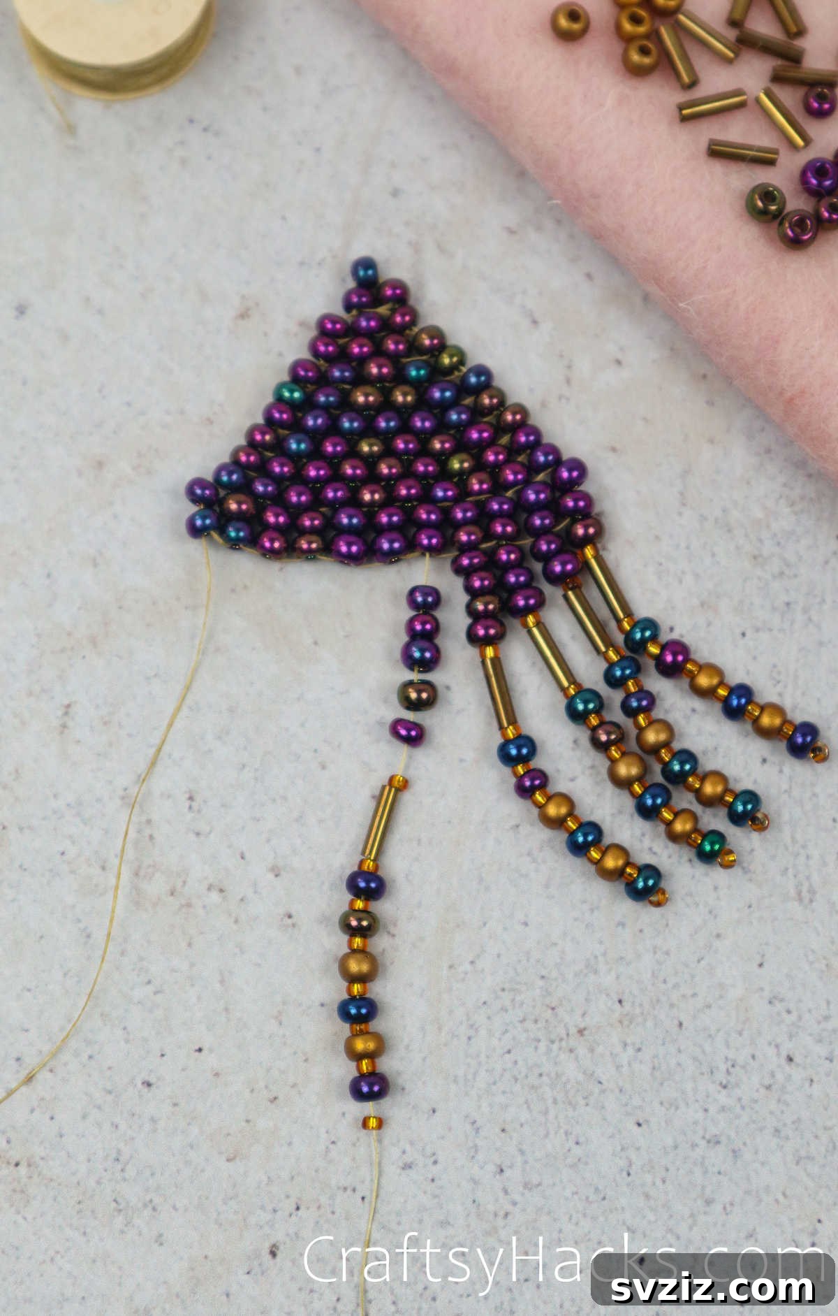 Craft Your Own Beaded Earrings 59 The longest fringe strand being added, marking the center of the design.